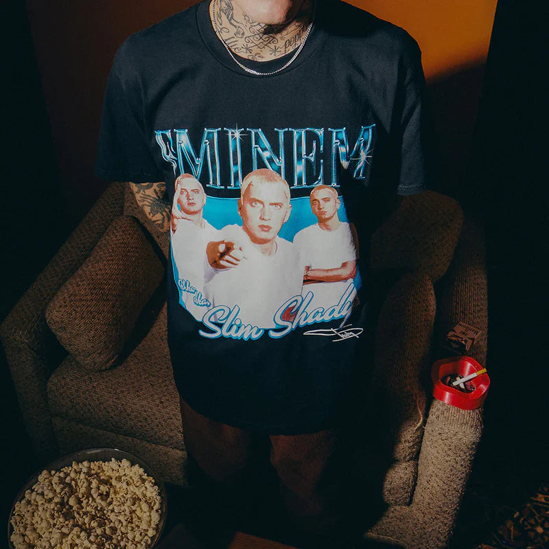Close-up of the Eminem SSLP25 Bootleg T-shirt on a model, highlighting the detailed print of Eminem's transformative Slim Shady images.